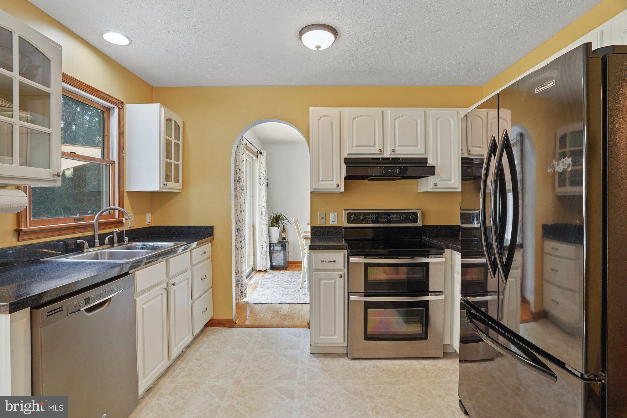 570 Conowingo Road Conowingo, MD 21918 - Photo 7 of 29 a kitchen with stainless steel appliances granite countertop a stove a refrigerator and a sink