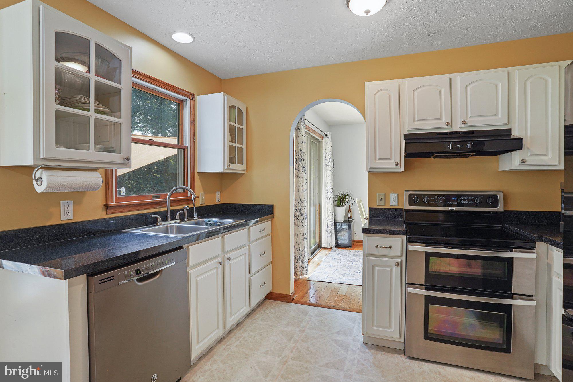 570 Conowingo Road Conowingo, MD 21918 - Photo 8 of 29 a kitchen with stainless steel appliances granite countertop a stove and a refrigerator