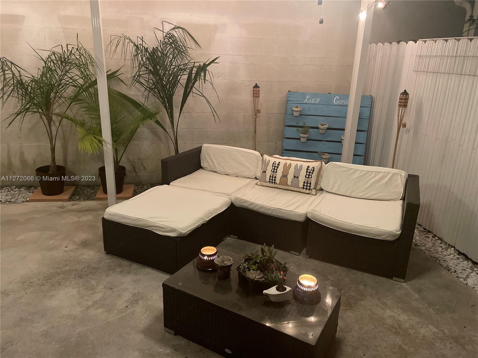 11115 West Okeechobee Road, Unit 176 Hialeah Gardens, FL 33018 - Photo 11 of 12 a living room with furniture and a couch