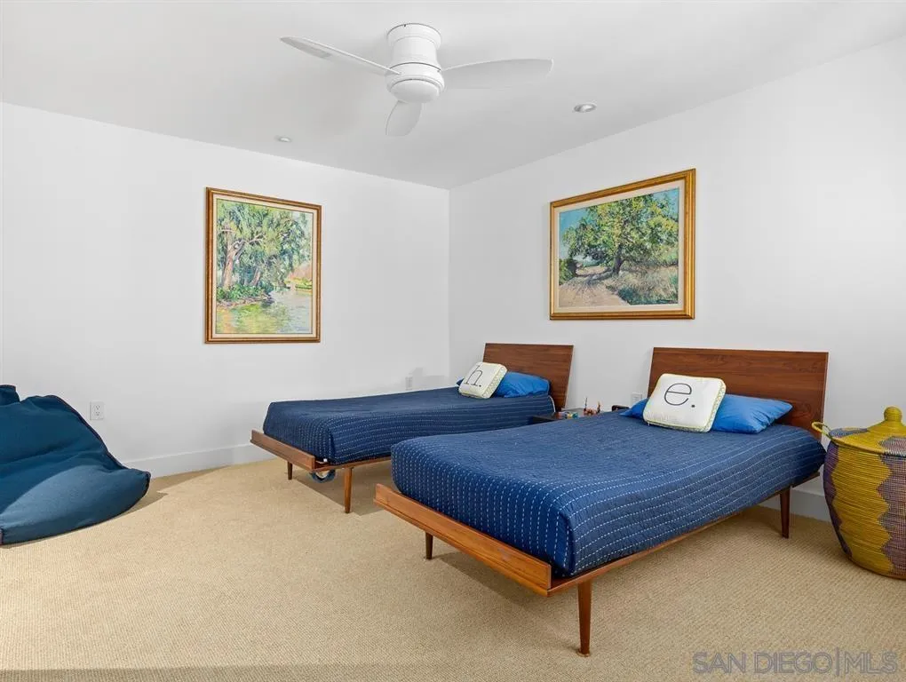 7970 Roseland Drive La Jolla, CA 92037 - Photo 19 of 23 a bedroom with bed and a window