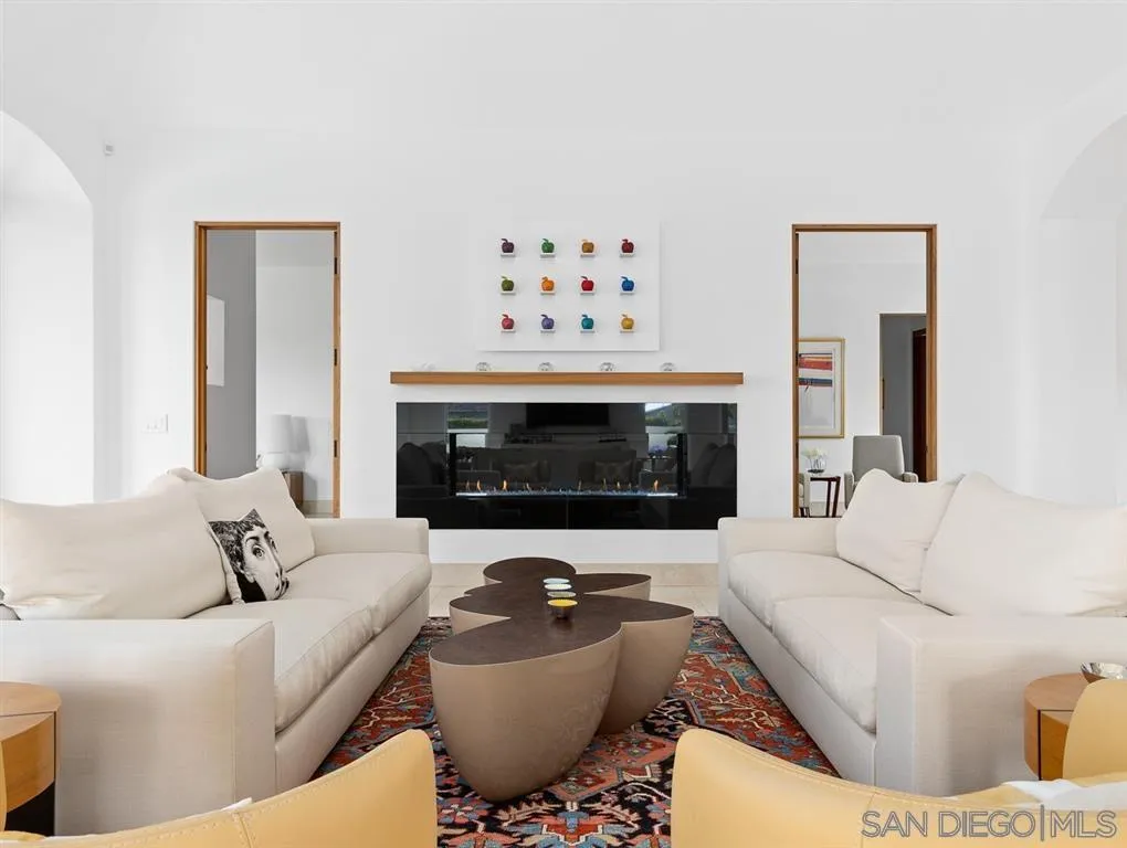 7970 Roseland Drive La Jolla, CA 92037 - Photo 10 of 23 a living room with furniture and a fireplace