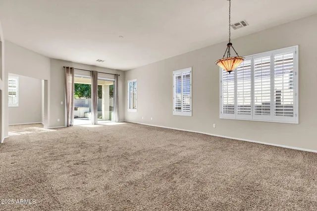 a kitchen with a refrigerator sink and cabinets