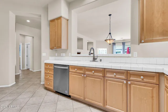 a white refrigerator freezer and a stove in a kitchen