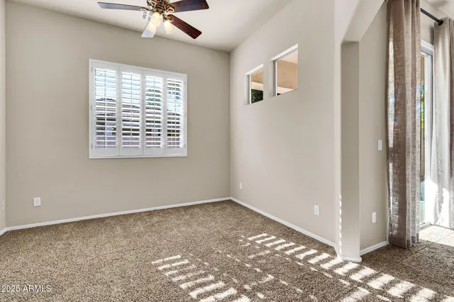 a view of a big room with closet and windows