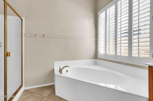 a view of a bathroom with a shower and a mirror