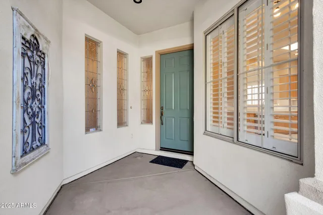 a view of a house with potted plants