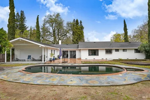 a front view of a house with swimming pool