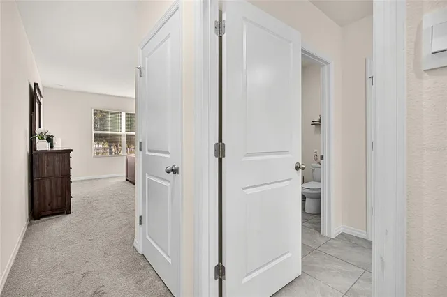 a bed room with a bed and a window