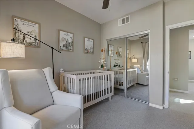 a bedroom with furniture and a window