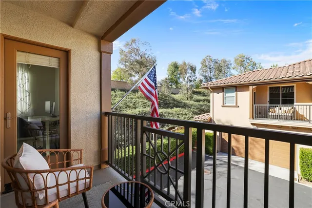 a view of a balcony with furniture