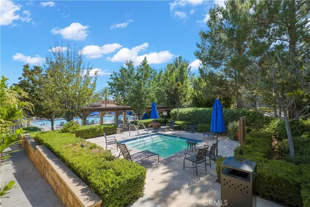 a view of a backyard with sitting area