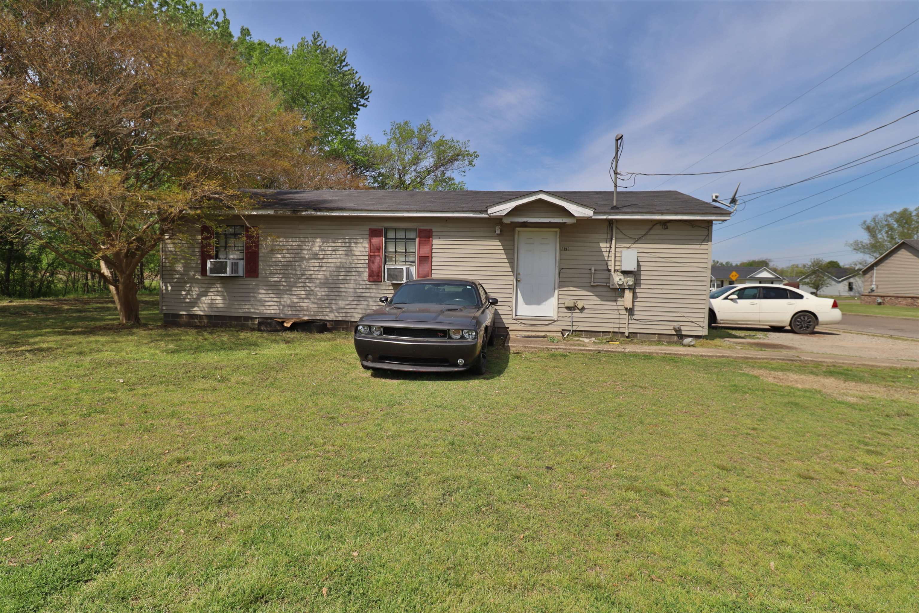 319 Wayne Avenue Ripley, TN 38063 - Photo 6 of 10 a front view of a house with swimming pool table and chairs