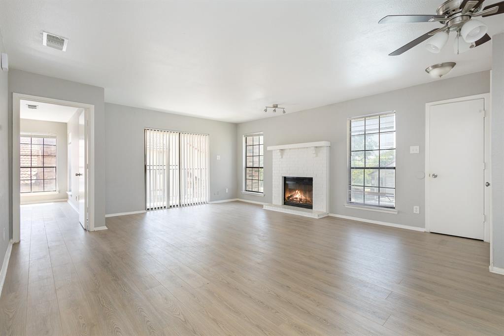 932 Turtle Cove, Unit 256 Irving, TX 75060 - Photo 1 of 1 Roomy living room with Wood-burning fireplace