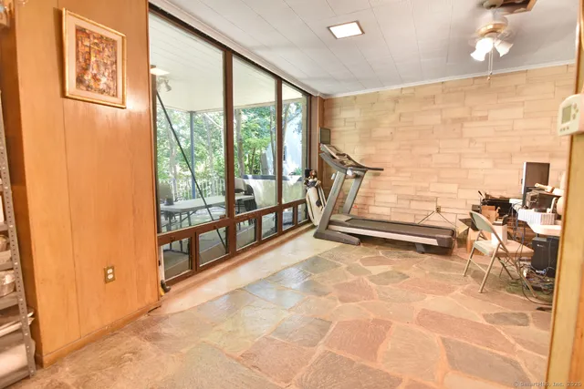 a view of an empty room and floor to ceiling window
