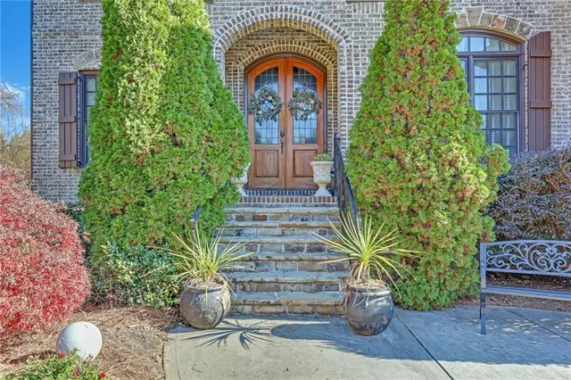 a front view of a house with garden