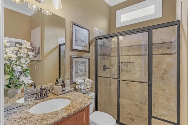 a living room with furniture flowerpot and window
