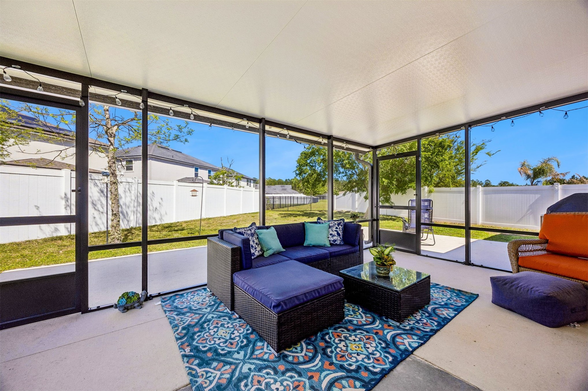 95159 Timberlake Drive Fernandina Beach, FL 32034 - Photo 23 of 33 a living room with furniture and a floor to ceiling window