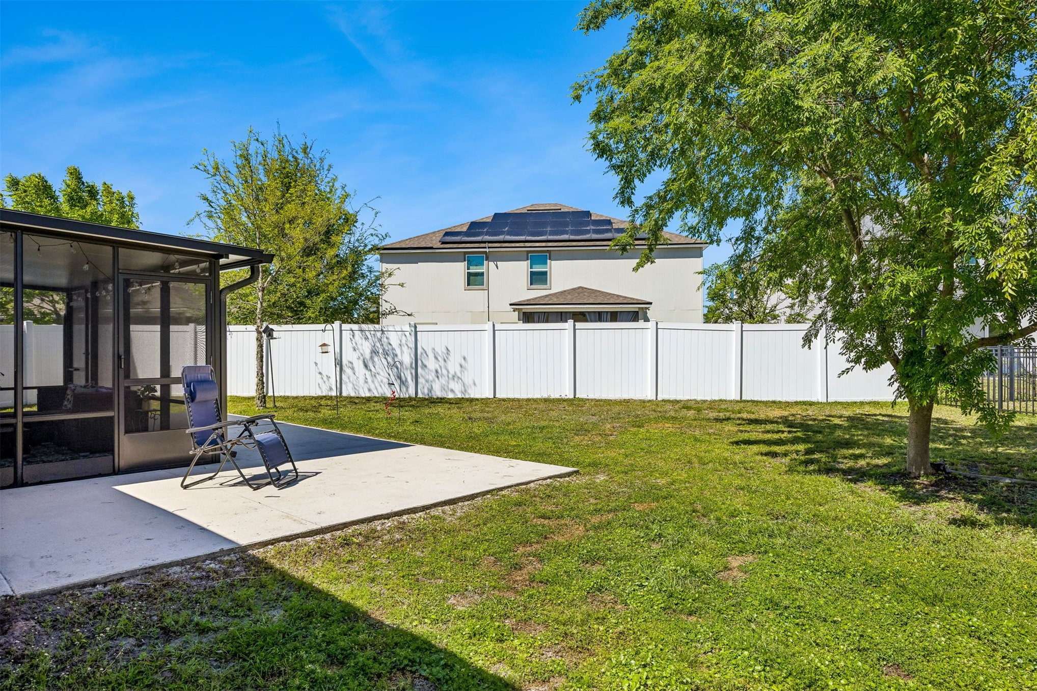 95159 Timberlake Drive Fernandina Beach, FL 32034 - Photo 24 of 33 a swimming pool with outdoor seating and yard