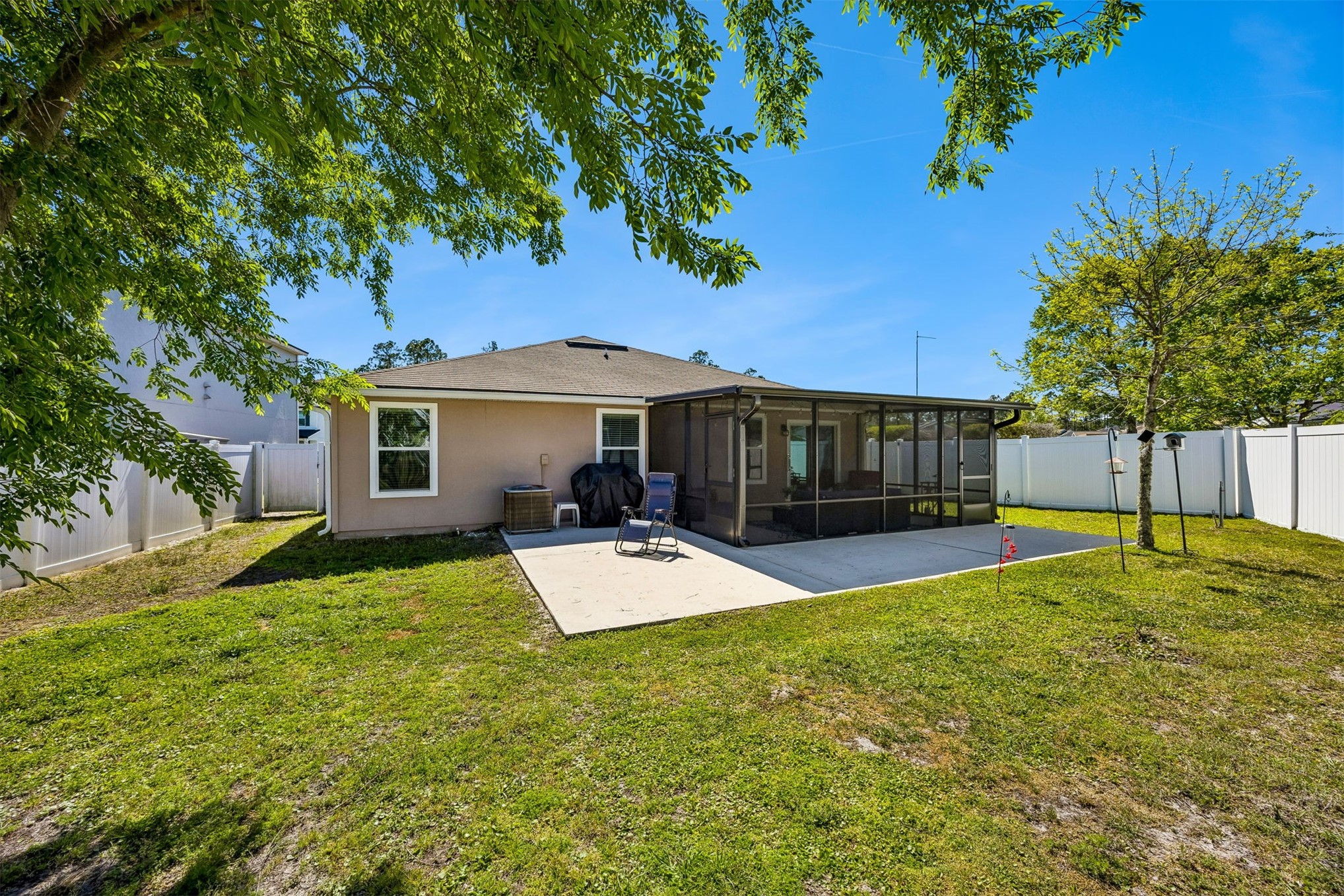 95159 Timberlake Drive Fernandina Beach, FL 32034 - Photo 25 of 33 a view of a house with a yard and sitting area