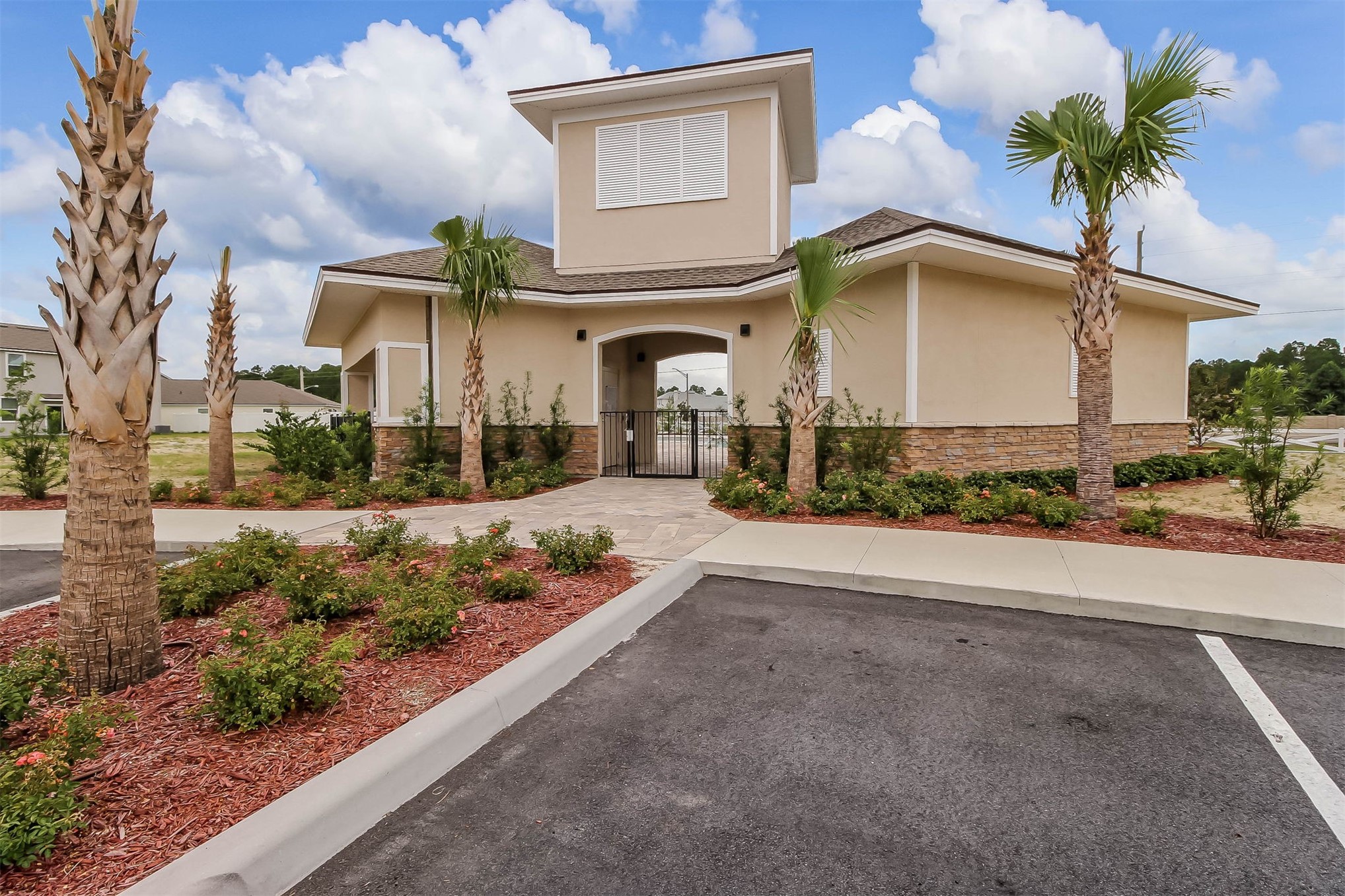 95159 Timberlake Drive Fernandina Beach, FL 32034 - Photo 28 of 33 a front view of a house with a yard and a garage