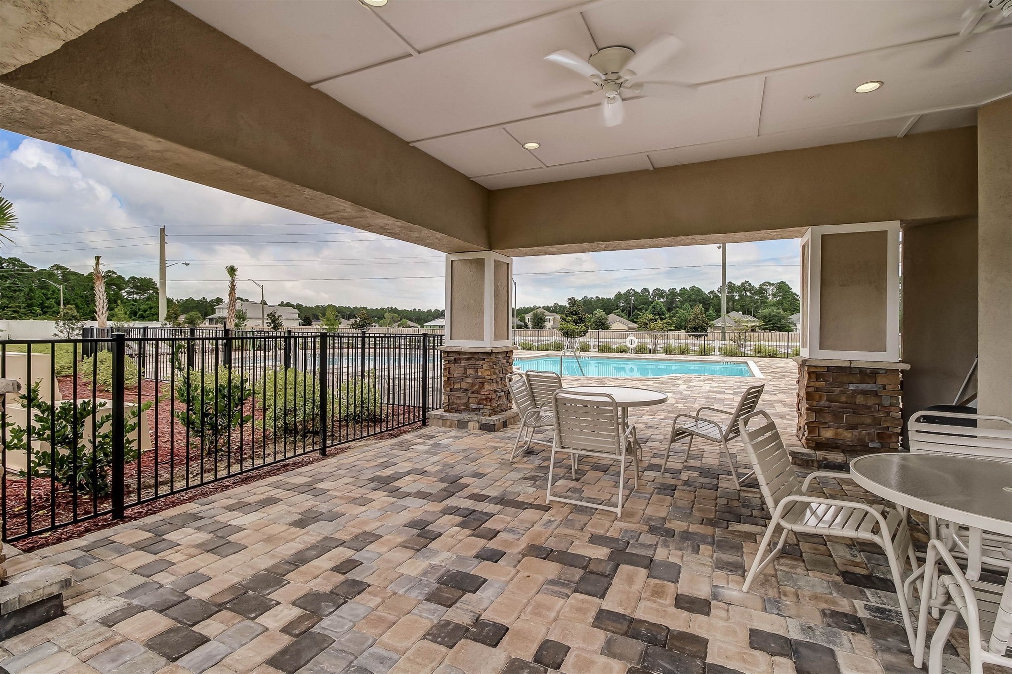 95159 Timberlake Drive Fernandina Beach, FL 32034 - Photo 29 of 33 a view of a patio with a table chairs and a patio