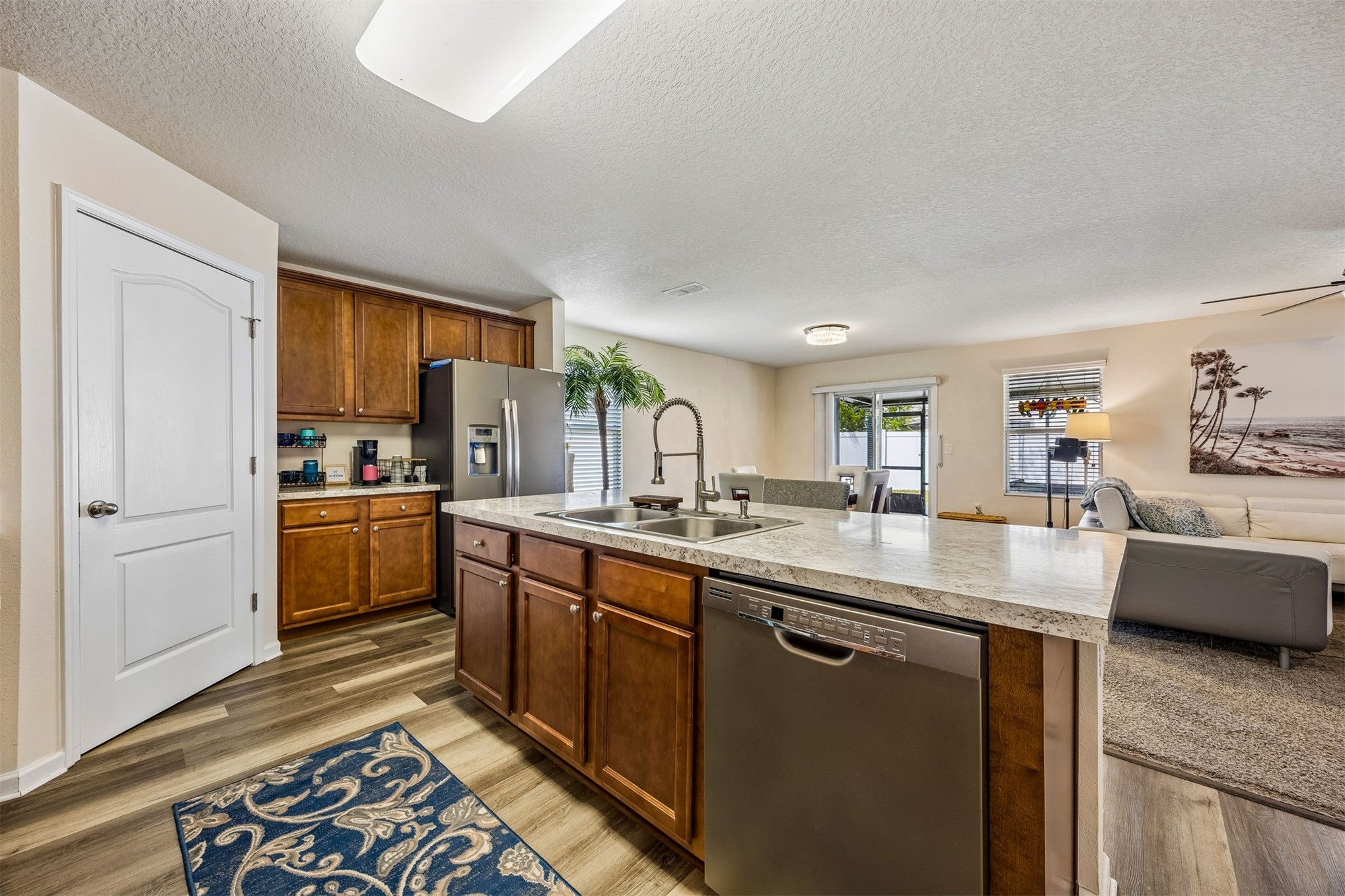 95159 Timberlake Drive Fernandina Beach, FL 32034 - Photo 5 of 33 a kitchen with stainless steel appliances granite countertop a sink stove and refrigerator