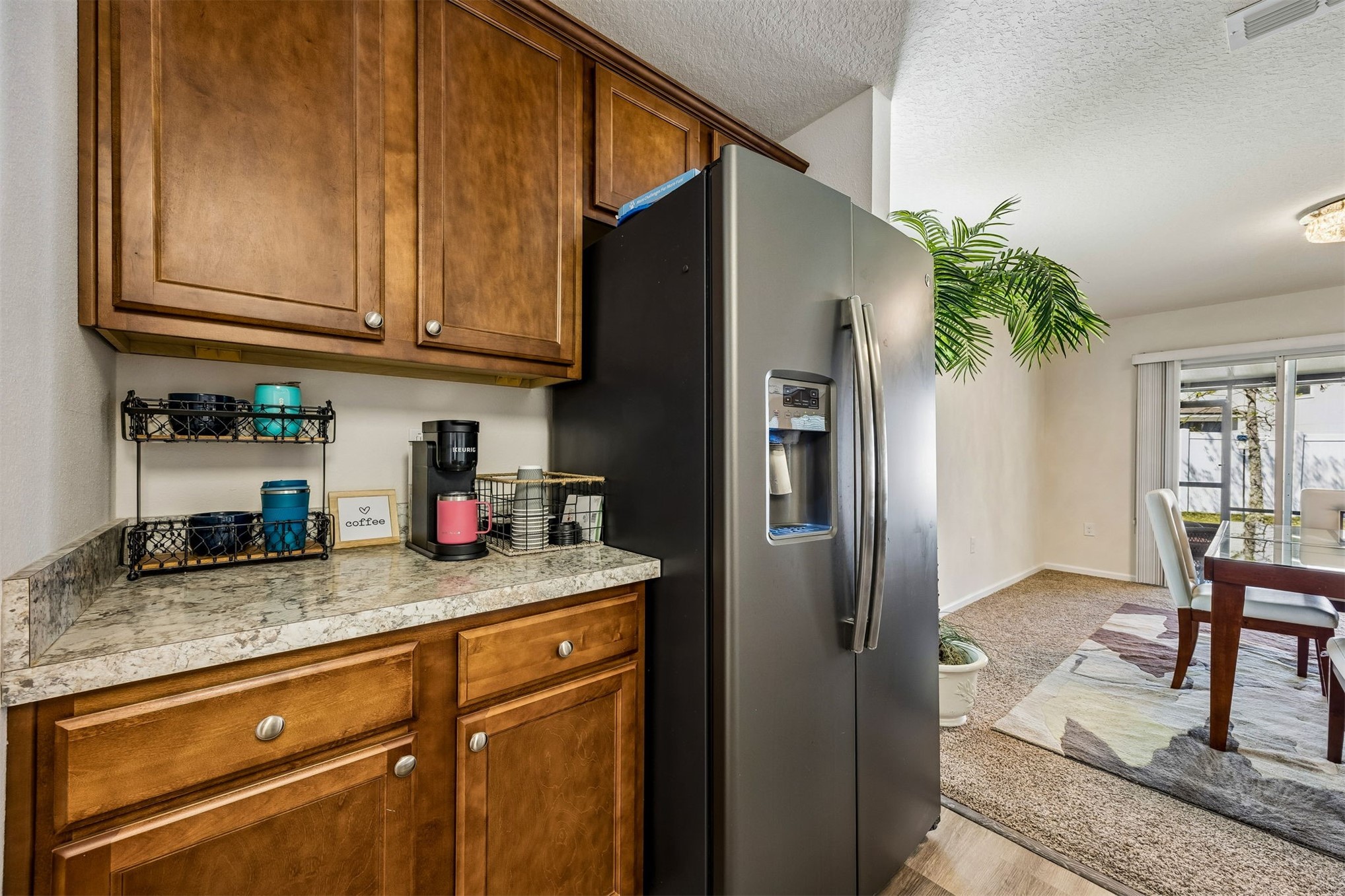 95159 Timberlake Drive Fernandina Beach, FL 32034 - Photo 7 of 33 a kitchen with stainless steel appliances granite countertop a refrigerator and a stove top oven