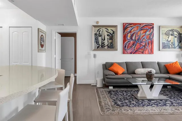 a living room with furniture and a rug