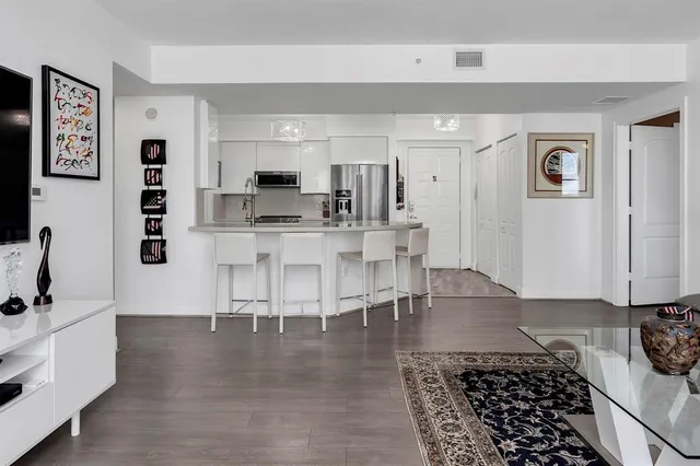 a bedroom with a bed and wall painting