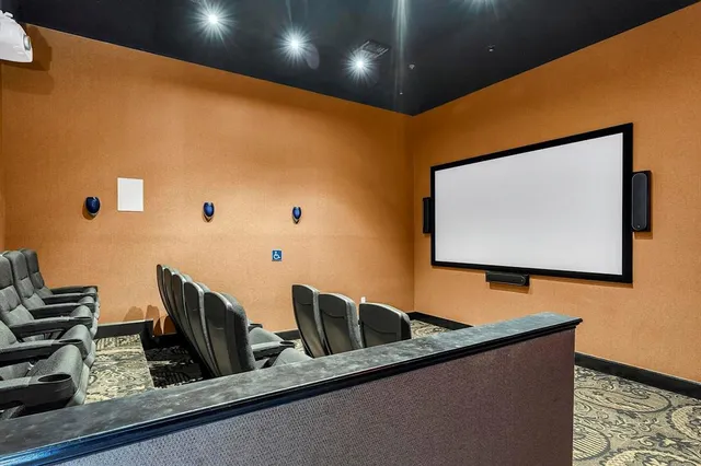 a swimming pool with a yard in the back