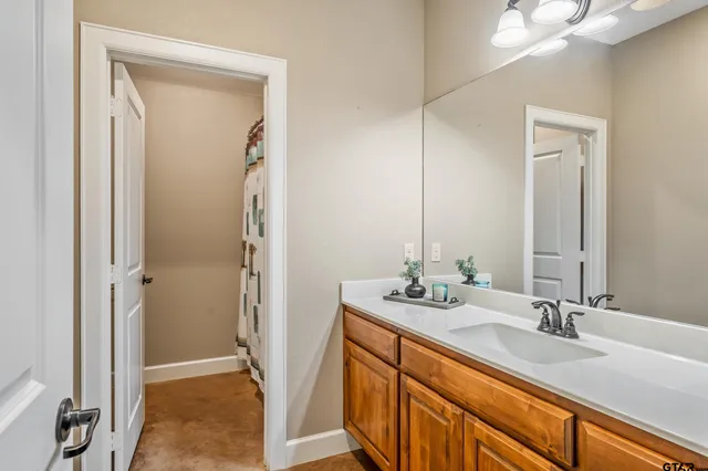 a bathroom with 2 sink and a mirror