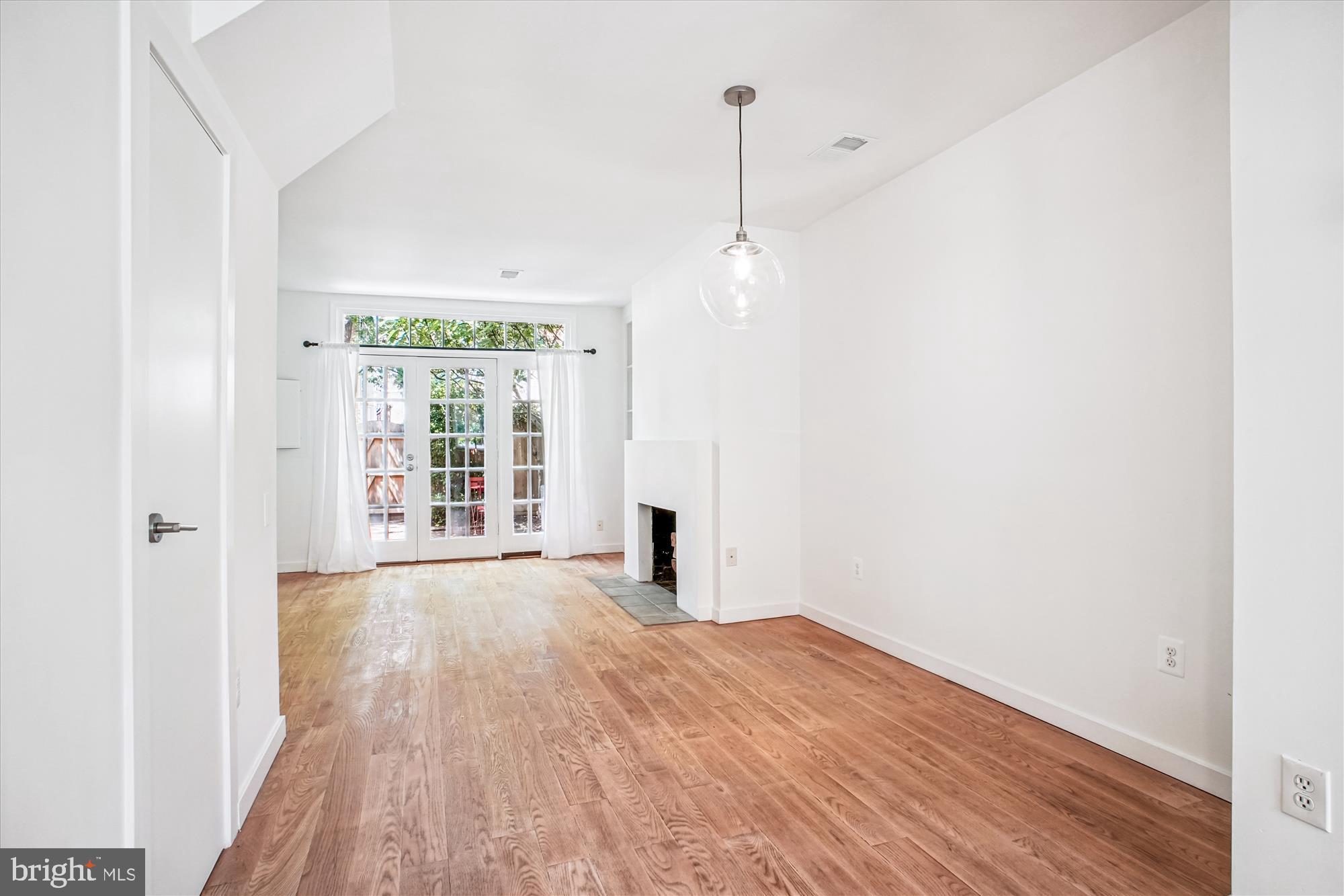 1229 Portner Road Alexandria, VA 22314 - Photo 22 of 47 a view of empty room with wooden floor and fan