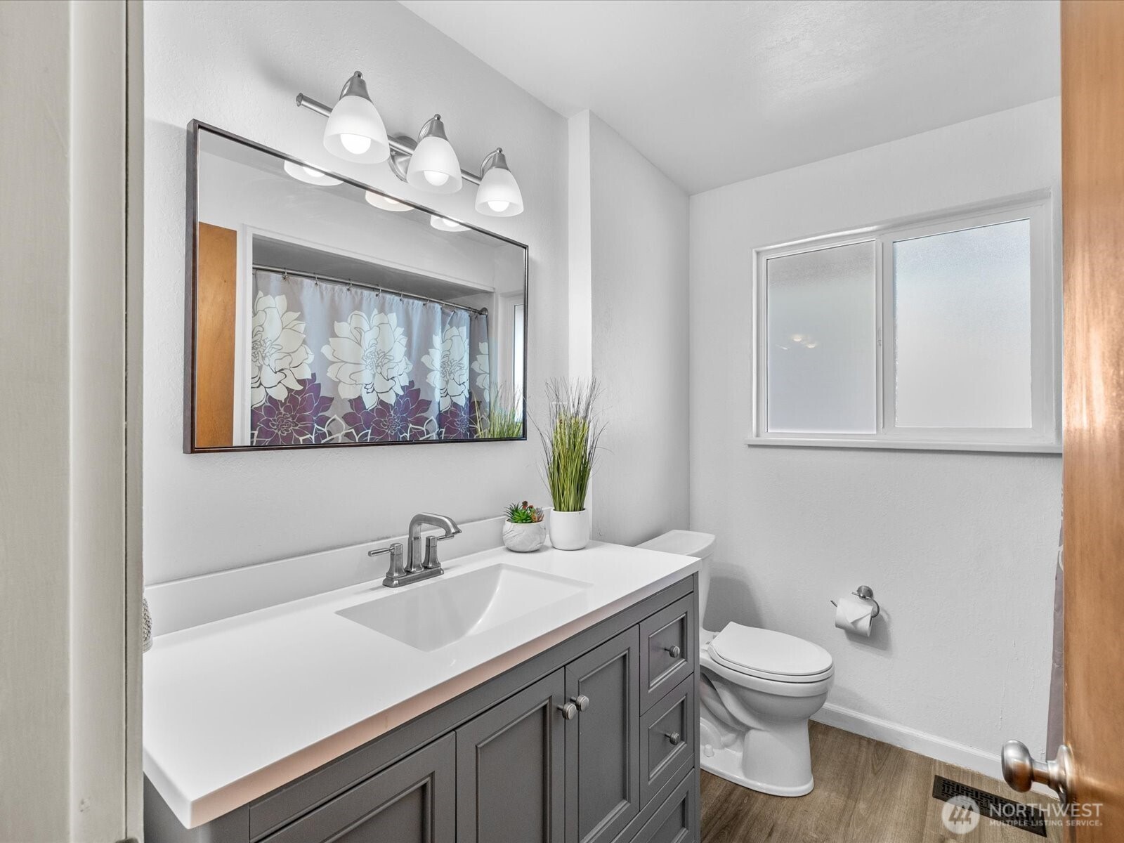 4913 West View Drive Everett, WA 98203 - Photo 16 of 37 a bathroom with a sink vanity and a toilet