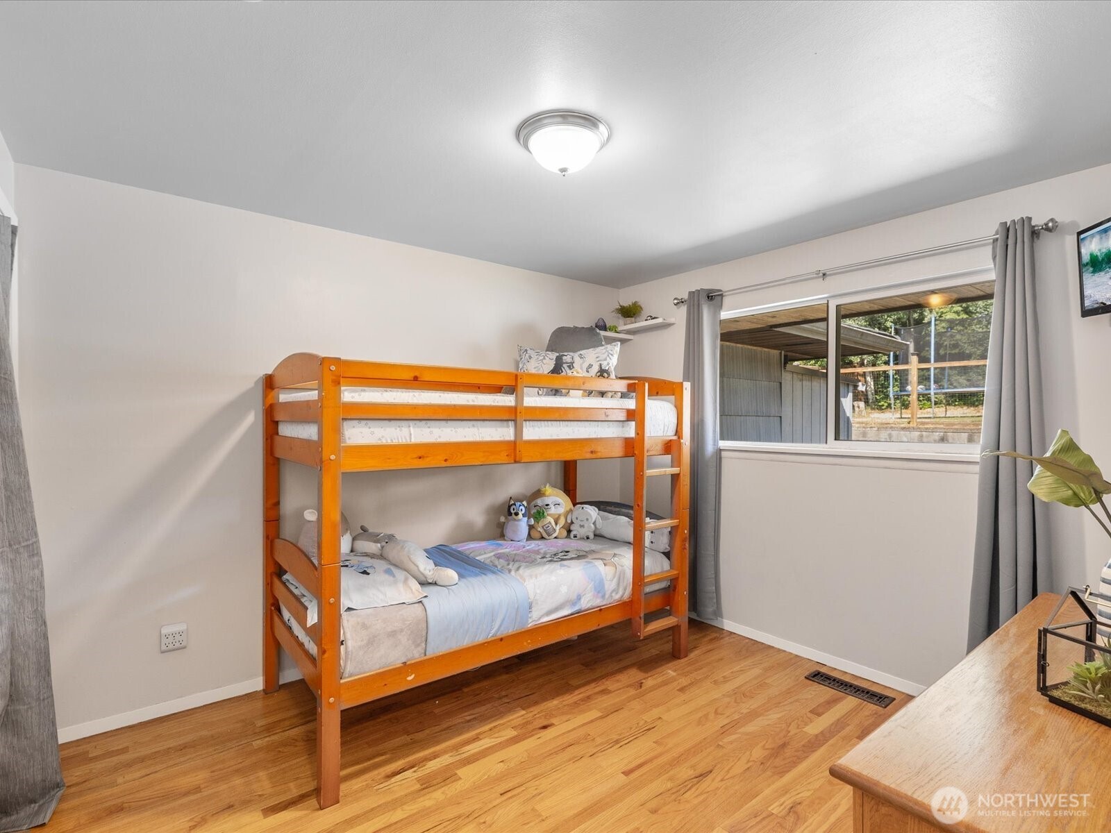 4913 West View Drive Everett, WA 98203 - Photo 17 of 37 a bedroom with bed and wooden floor