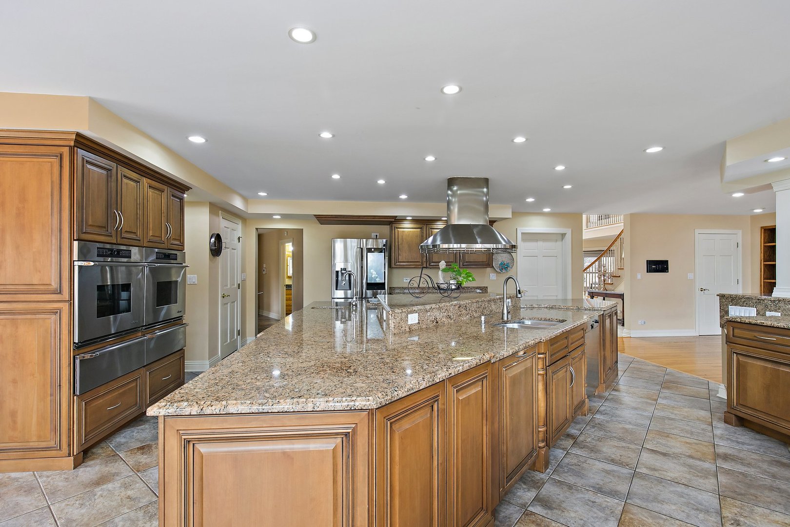 741 Braintree Lane Bartlett, IL 60103 - Photo 34 of 80 a kitchen with stainless steel appliances granite countertop a sink and stove