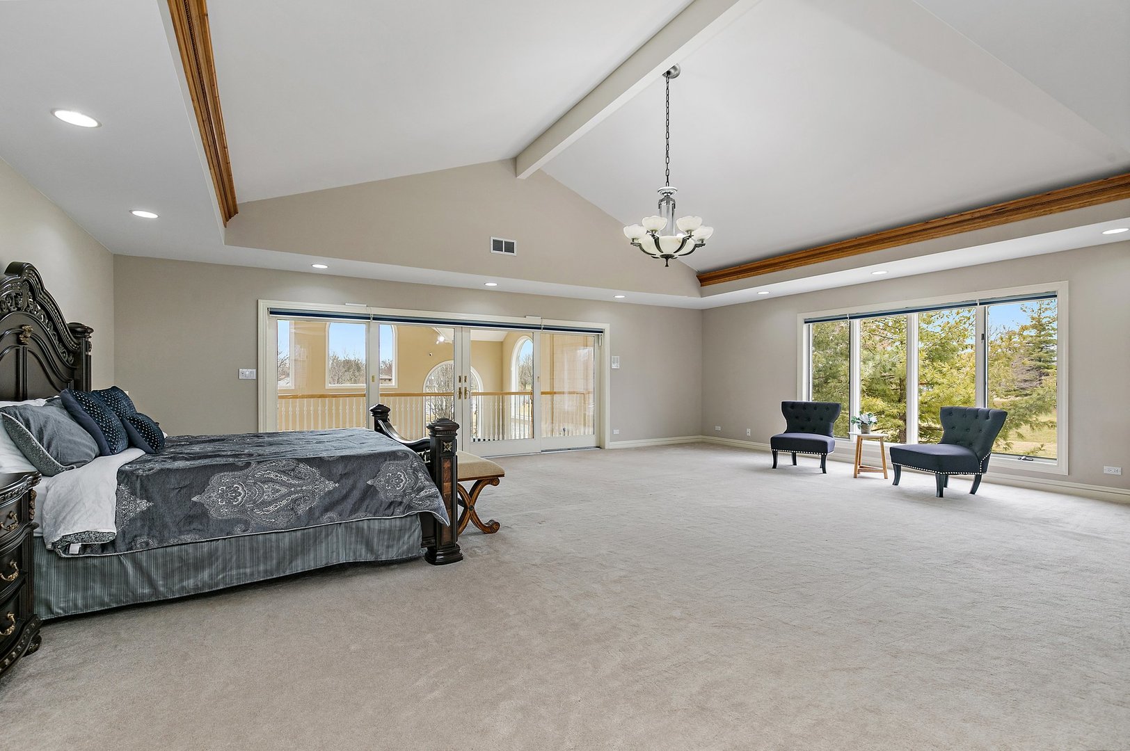 741 Braintree Lane Bartlett, IL 60103 - Photo 43 of 80 a spacious bedroom with a bed a couch and large window