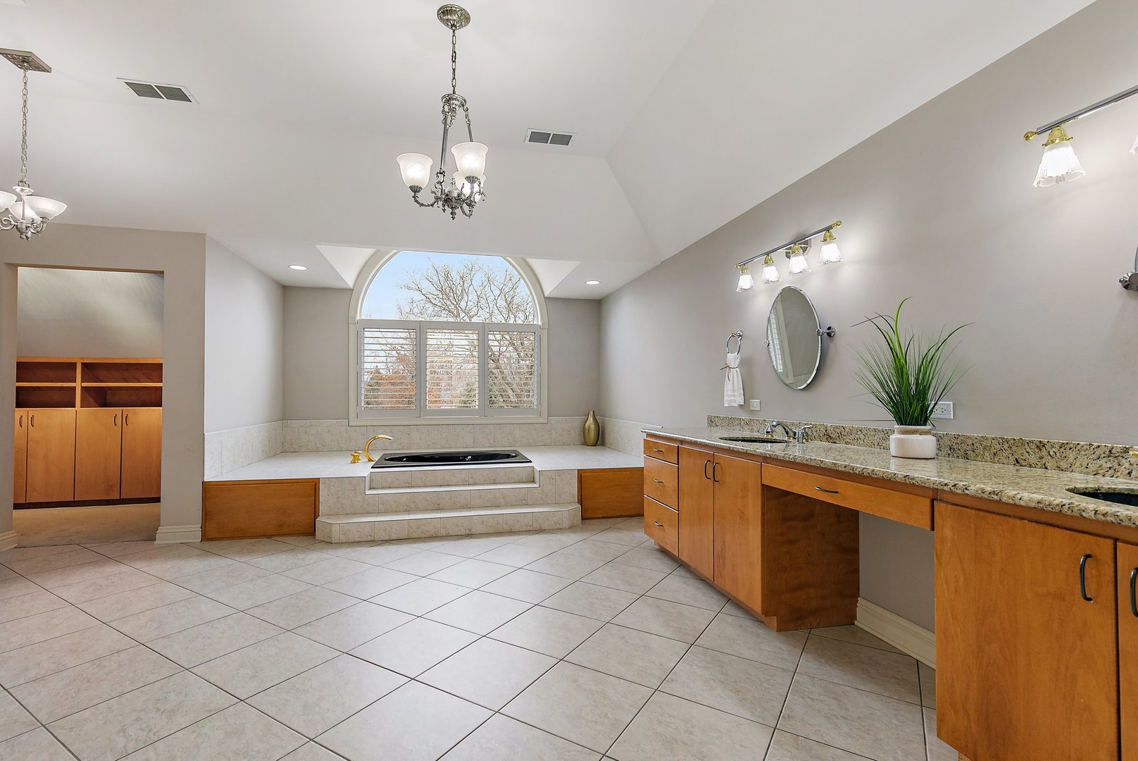 741 Braintree Lane Bartlett, IL 60103 - Photo 50 of 80 a large kitchen with kitchen island granite countertop a stove a sink and a chandelier