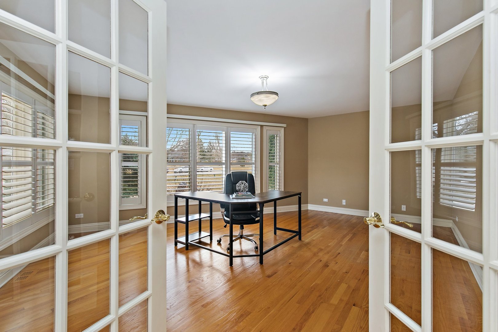 741 Braintree Lane Bartlett, IL 60103 - Photo 9 of 80 a view of a workspace with wooden floor and furniture