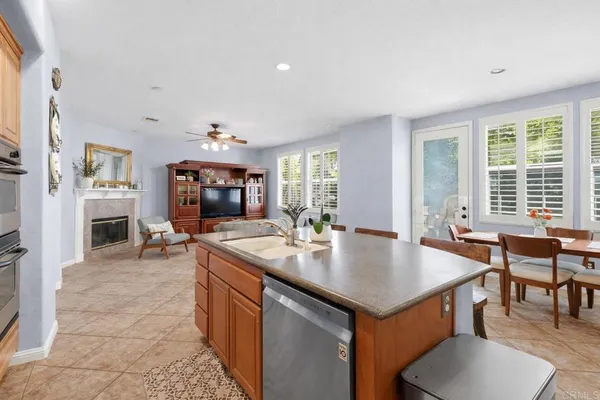 a view of kitchen island a sink and living room