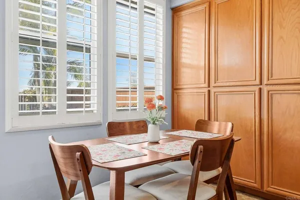 a view of a dining room with furniture window and outside view