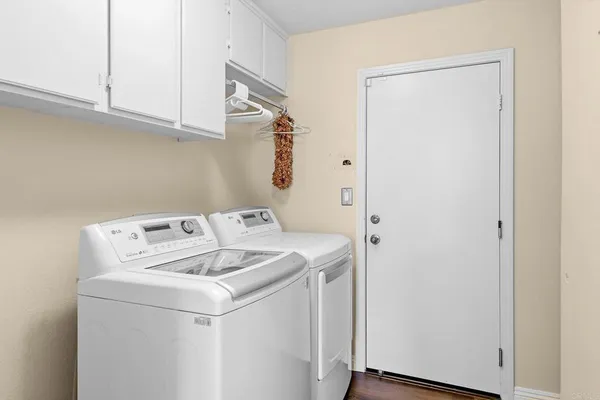 a utility room with dryer and washer