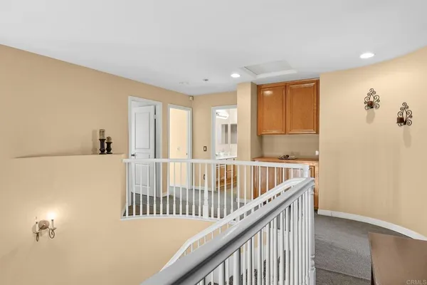 a view of a hallway with windows