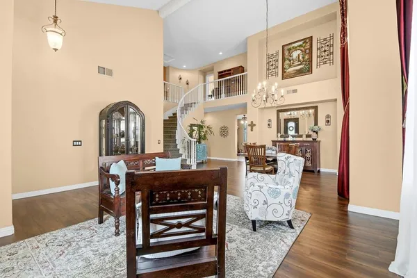 a view of a livingroom with furniture and wooden floor
