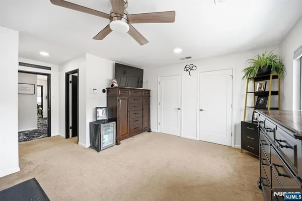 a view of a kitchen with furniture and a ceiling fan