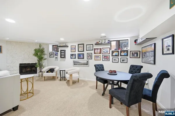 a living room with furniture and a bookshelf