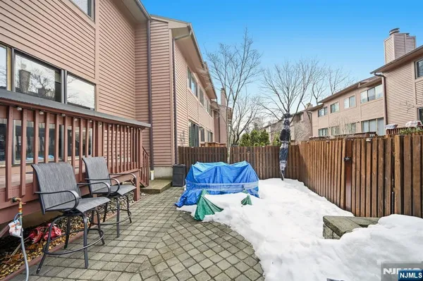 a view of backyard with a patio and outdoor seating