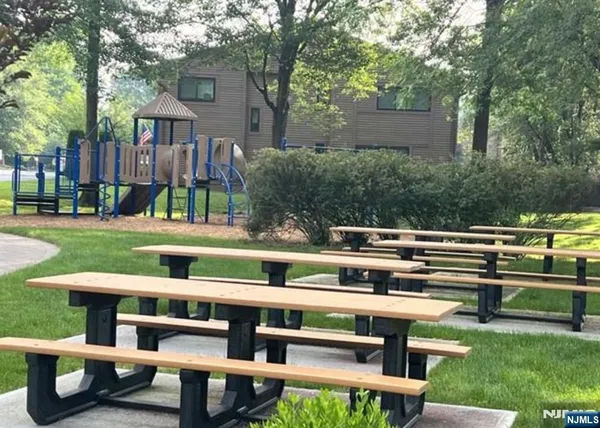 a view of a chairs and tables in the yard