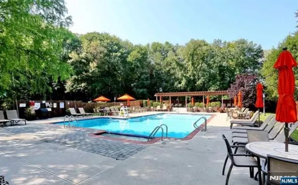 a view of a swimming pool with a patio