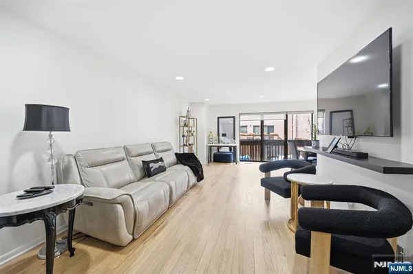 a living room with furniture and a lamp