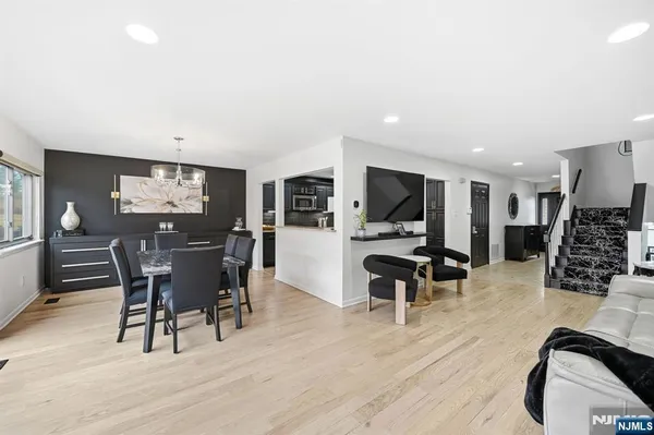 a view of a dining room with furniture and wooden floor